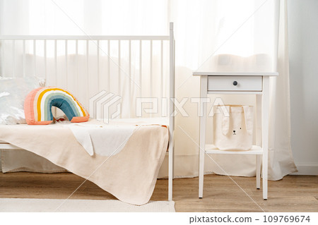 Kid's room interior with comfortable bed and rainbow pillow Kid's room interior with comfortable bed and rainbow pillow 109769674