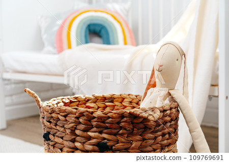 Kid's room interior with comfortable bed and rainbow pillow Kid's room interior with comfortable bed and rainbow pillow 109769691