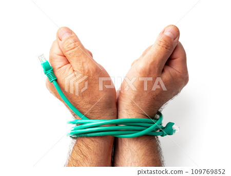 Man's hands tied with green cable on white background Man's hands tied with green cable on white background 109769852