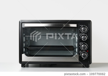 Electric mini oven on gray background studio shot 109770082