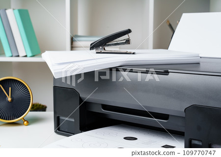 Workplace with modern printer and clock in the office Workplace with modern printer and clock in the office 109770747