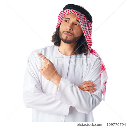Arab saudi young man pointing to side isolated on a white background Arab saudi young man pointing to side isolated on a white background 109770794