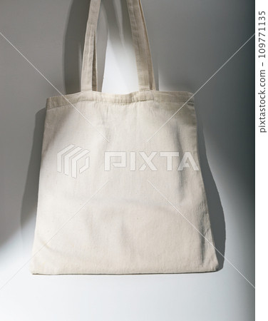 Eco tote bag in daylight. Recycled linen cotton textile shopper mockup Eco tote bag in daylight. Recycled linen cotton textile shopper mockup 109771135