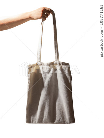 Hand carrying tote bag, isolated on white background. Natural cotton shopper 109771163