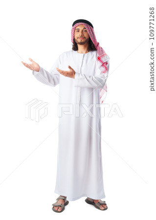 Arab saudi young man pointing to side isolated on a white background Arab saudi young man pointing to side isolated on a white background 109771268