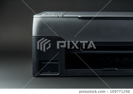 Modern laser printer on black background close up Modern laser printer on black background close up 109771298