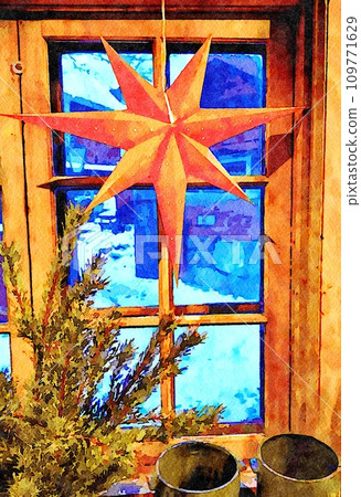 A decorative Christmas star hangs on the window. 109771629