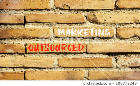 Outsourced marketing symbol. Concept words Outsourced marketing on beautiful brown brick wall. Beautiful brown brick wall background. Business Outsourced marketing concept. Copy space. Outsourced marketing symbol. Concept words Outsourced marketing on beautiful brown brick wall. Beautiful brown brick wall background. Business Outsourced marketing concept. Copy space. 109772249