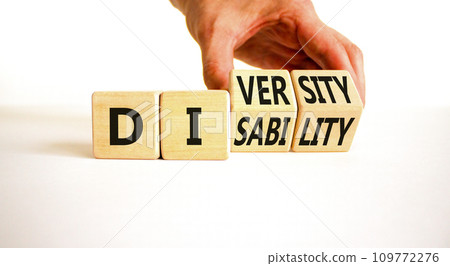 DEI Diversity or disability symbol. Concept words Diversity disability on wooden block. Beautiful white table white background. Businessman hand. Business diversity disability concept. Copy space. 109772276