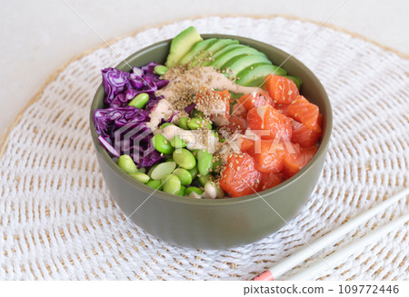 poke bowl with salmon on the light table poke bowl with salmon on the light table 109772446