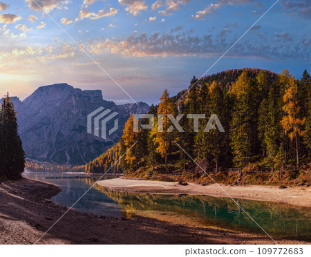 Autumn peaceful alpine lake Braies or Pragser Wildsee. Fanes-Sennes-Prags national park, South Tyrol, Dolomites Alps, Italy, Europe. Picturesque traveling, seasonal and nature beauty concept scene. Autumn peaceful alpine lake Braies or Pragser Wildsee. Fanes-Sennes-Prags national park, South Tyrol, Dolomites Alps, Italy, Europe. Picturesque traveling, seasonal and nature beauty concept scene. 109772683