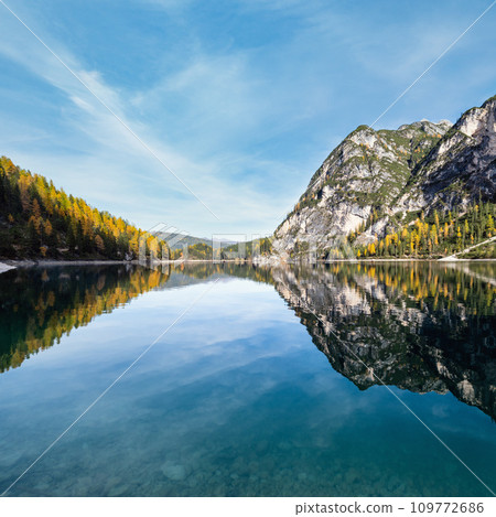 Autumn peaceful alpine lake Braies or Pragser Wildsee. Fanes-Sennes-Prags national park, South Tyrol, Dolomites Alps, Italy, Europe. Picturesque traveling, seasonal and nature beauty concept scene. Autumn peaceful alpine lake Braies or Pragser Wildsee. Fanes-Sennes-Prags national park, South Tyrol, Dolomites Alps, Italy, Europe. Picturesque traveling, seasonal and nature beauty concept scene. 109772686