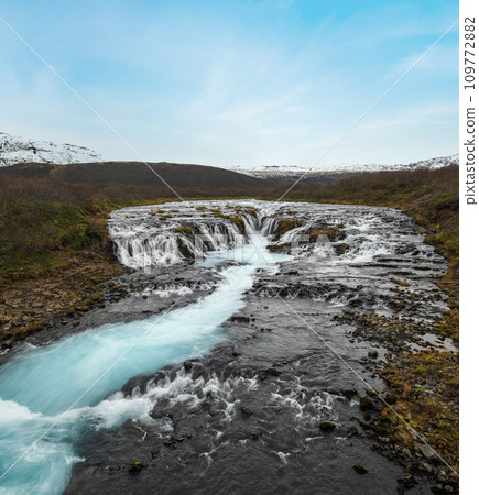 Picturesque waterfall Bruarfoss autumn view. Season changing in southern Highlands of Iceland. 109772882