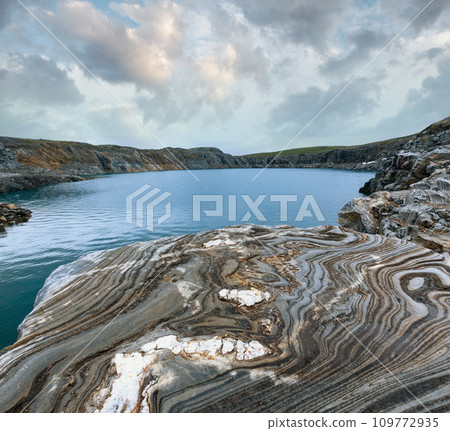 Striped stone near reservoir Storglomvatnet (Norge) 109772935