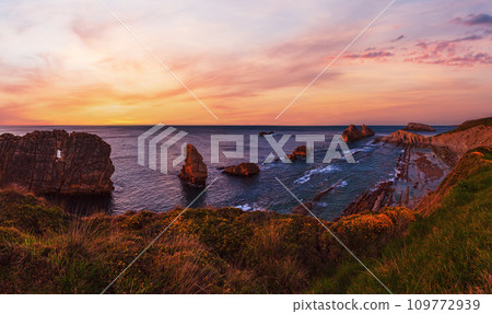 Sunset Arnia Beach coastline landscape. 109772939
