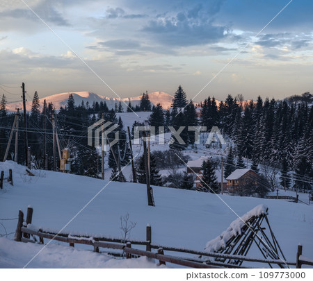 Small and quiet alpine village outskirts and winter sunrise snowy mountains around, Voronenko, Carpathian, Ukraine. Small and quiet alpine village outskirts and winter sunrise snowy mountains around, Voronenko, Carpathian, Ukraine. 109773000