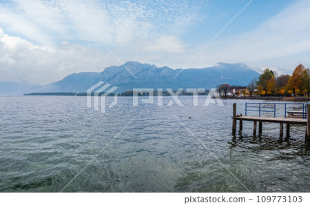 Autumn Alps mountain lake Mondsee view, Salzkammergut, Upper Austria. Autumn Alps mountain lake Mondsee view, Salzkammergut, Upper Austria. 109773103
