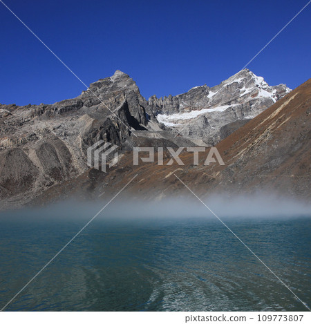 Morning fog over lake Dudh Pokhari. Renjo Pass, Gokyo. 109773807
