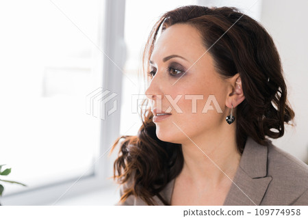 Detail of young woman wearing beautiful luxury earring close-up. Handmade jewellery and accessories copy space Detail of young woman wearing beautiful luxury earring close-up. Handmade jewellery and accessories copy space 109774958