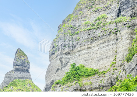 Geological strata exposed on a cliff Geological strata exposed on a cliff 109777426