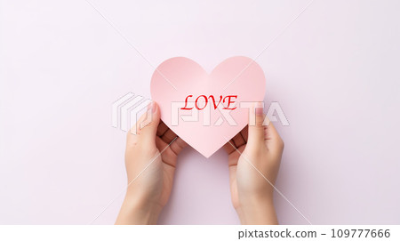 Hands holding heart-shaped pink paper on white background. Generative AI. 109777666