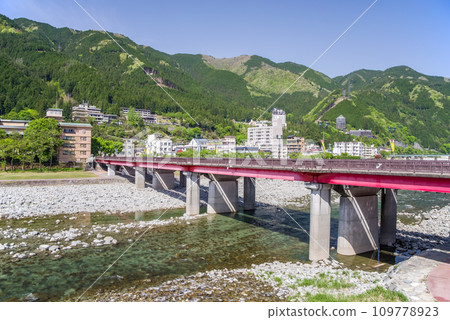Gero Onsen Town and Gero Ohashi Bridge during the fresh green season 109778923