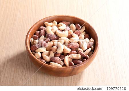 mixed nuts on a plate mixed nuts on a plate 109779528
