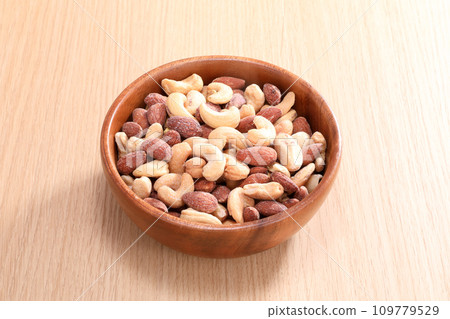 mixed nuts on a plate mixed nuts on a plate 109779529