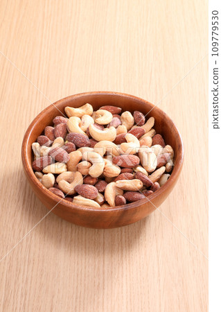 mixed nuts on a plate mixed nuts on a plate 109779530
