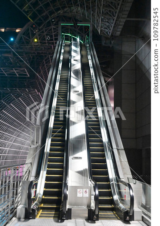 Long escalator to Kyoto Station building aerial pathway 109782545