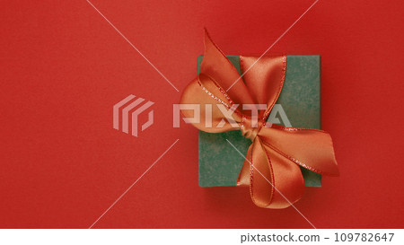 Photo of a gift box on a red background. Photo of a gift box on a red background. 109782647