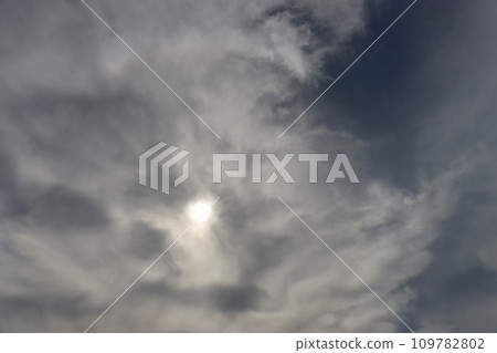 The sun is hidden behind thick clouds. The sun is hidden behind thick clouds. 109782802
