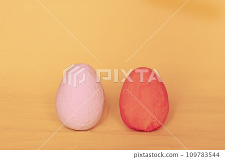 red and pink egg on yellow background. red and pink egg on yellow background. 109783544