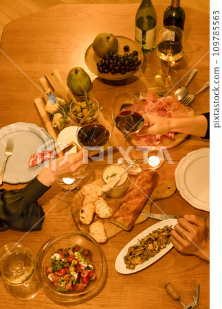 A couple toasting with wine A couple toasting with wine 109785563