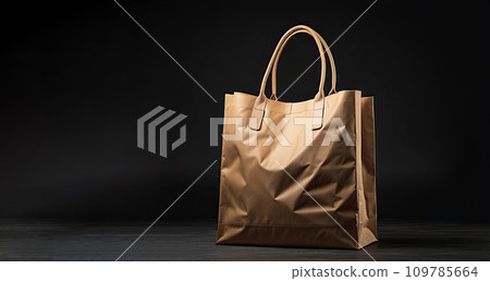 Natural paper shopping bag close-up on a black background, copy space. Black Friday, discounts, sale. 109785664