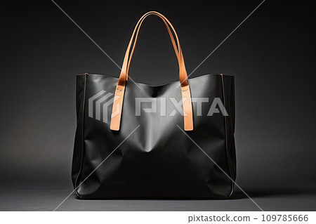 Black leather shopping bag close-up on a black background. Black Friday, discounts, sale. 109785666