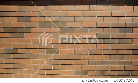 Modern brick wall of a house. Decorative brick. The walls are built of modern brick. Brick wall made of decorative bricks. Modern brick wall of a house. Decorative brick. The walls are built of modern brick. Brick wall made of decorative bricks. 109787243