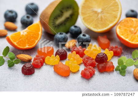 Chewable gummy vitamins and fruits Chewable gummy vitamins and fruits 109787247