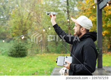 Man playing with drone Man playing with drone 109787259