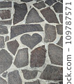 cobblestones in the shape of a heart 109787571