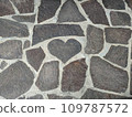 cobblestones in the shape of a heart 109787572