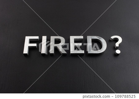 the question fired laid with silver metal letters on flat black surface the question fired laid with silver metal letters on flat black surface 109788525