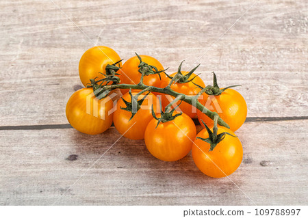 Ripe yellow cherry tomato branch 109788997