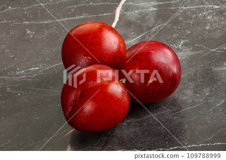 Ripe sweet juicy red plum 109788999