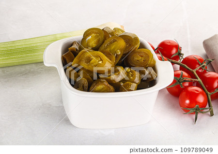 Sliced canned jalapeno pepper Sliced canned jalapeno pepper 109789049