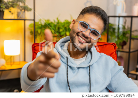 Happy Indian man smiling, pointing to camera, choosing lucky winner, indicating, inviting, approve 109789084