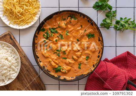 Chicken strogonoff accompanied with rice and potato straw. Chicken strogonoff accompanied with rice and potato straw. 109791302