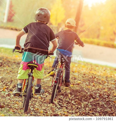 Kids riding bicycles Kids riding bicycles 109791861