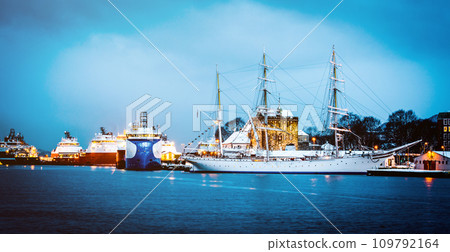 Vessels docked in harbor in the evening, Bergen, Norway 109792164