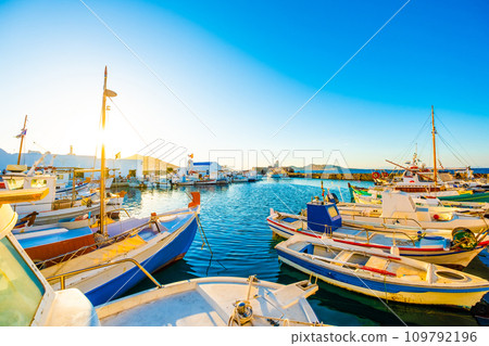 Sunshine view of turquoise bay with colorful yachts of greek island Paros Sunshine view of turquoise bay with colorful yachts of greek island Paros 109792196
